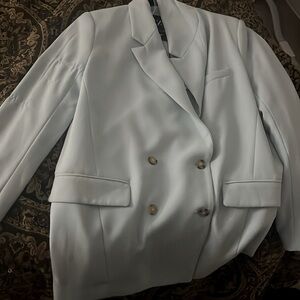 Never worn before still has original tag . Size large blazer .
